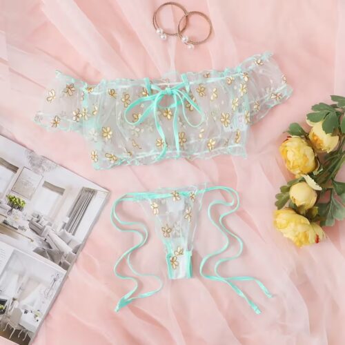 Off-shoulder transparent polka-dot mesh top layered over a floral lace bra