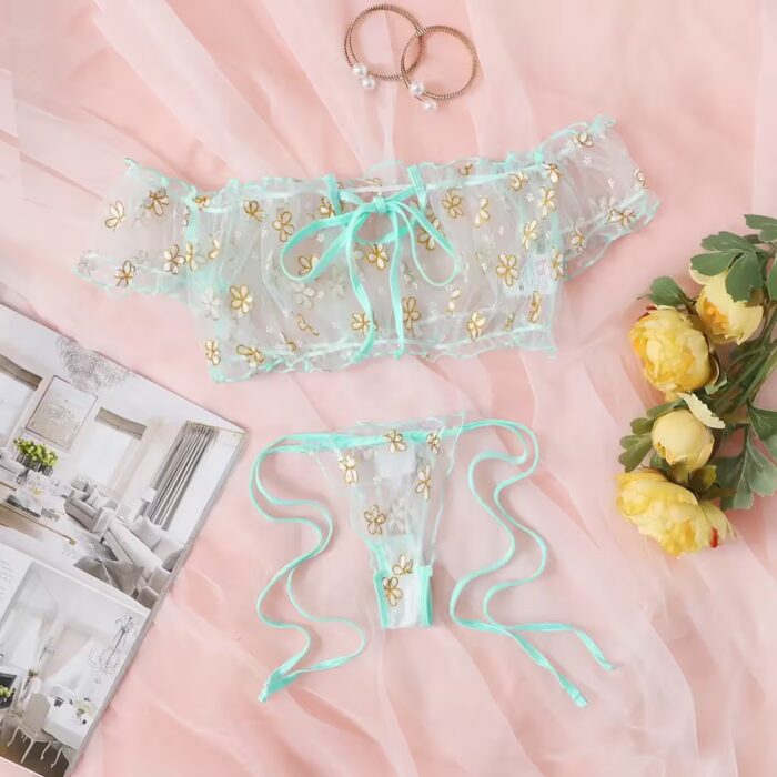 Off-shoulder transparent polka-dot mesh top layered over a floral lace bra