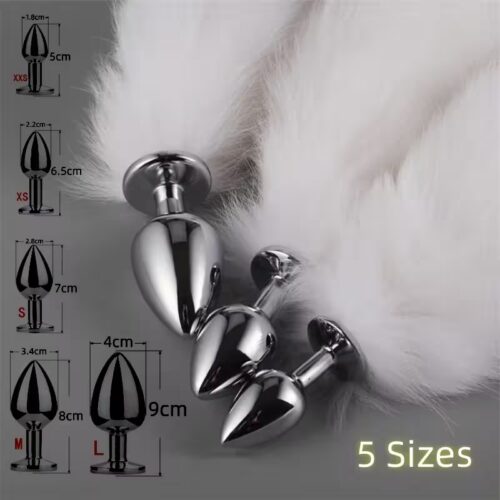 Five stainless-steel butt plugs of ascending sizes, each with a soft faux-fox tail attached
