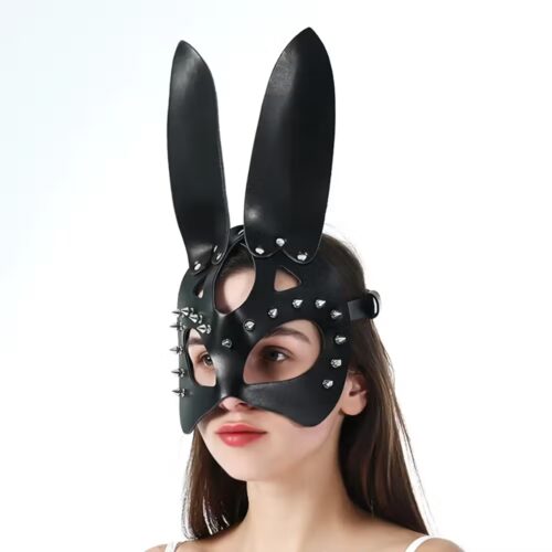 Black leather bunny mask with upright ears and removable on satin backdrop